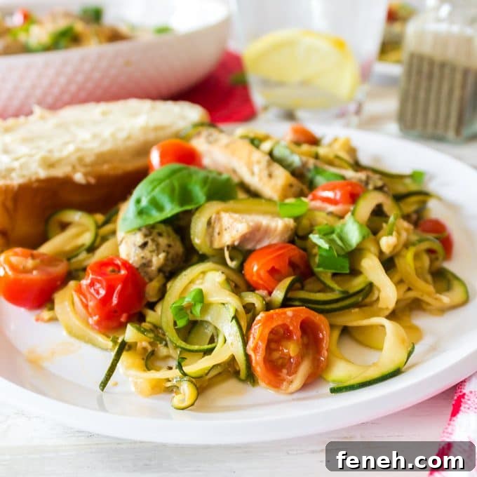 Plate of food with cherry tomatoes and chicken.