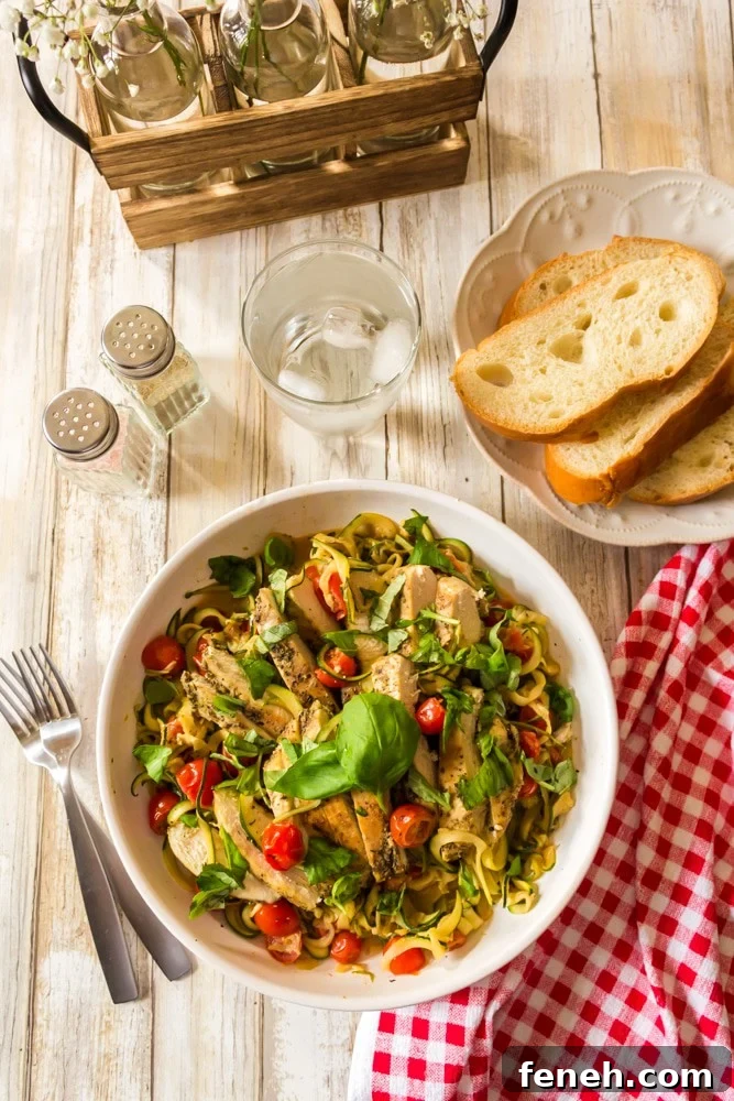 A plate of food with a side dish of bread.