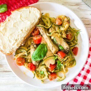 A plate of veggie noodels with chicken
