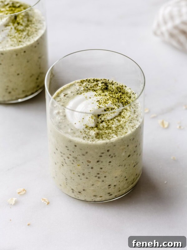 two cups of matcha overnight oats topped with yogurt