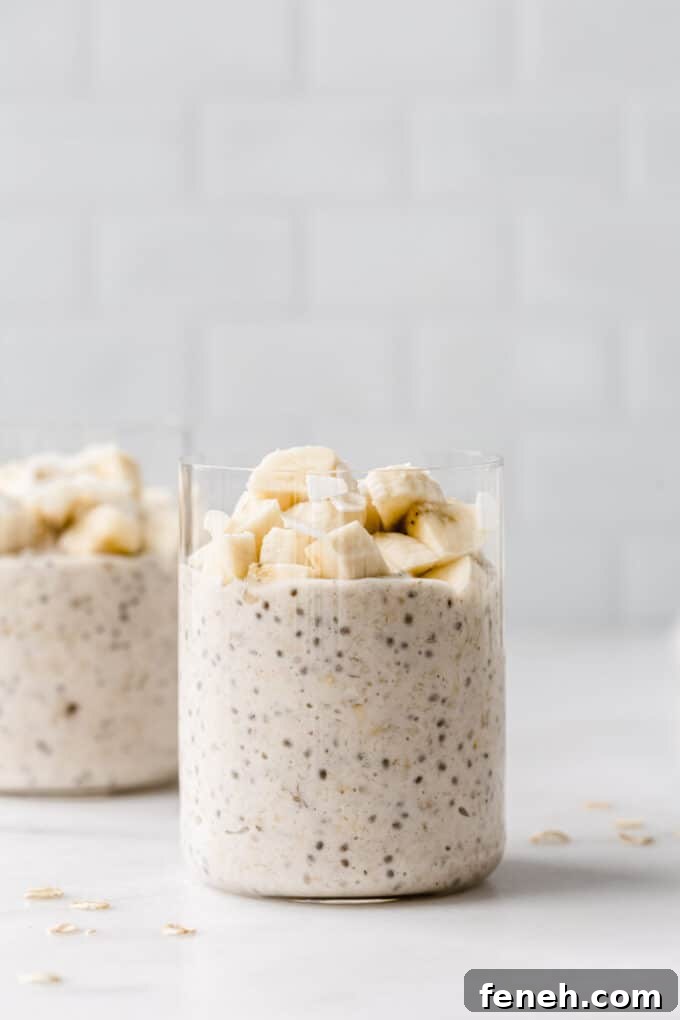 two cups of banana overnight oats topped with banana.