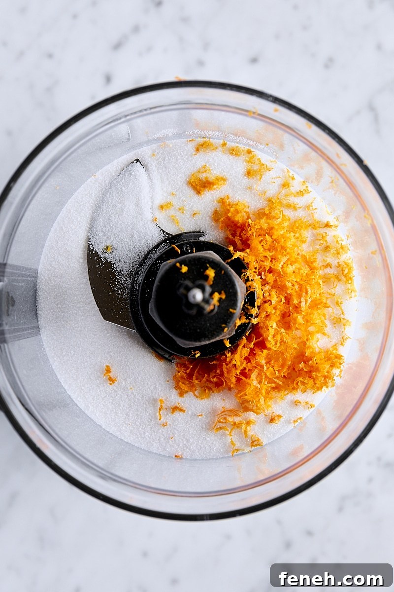 Orange zest and granulated sugar in food processor