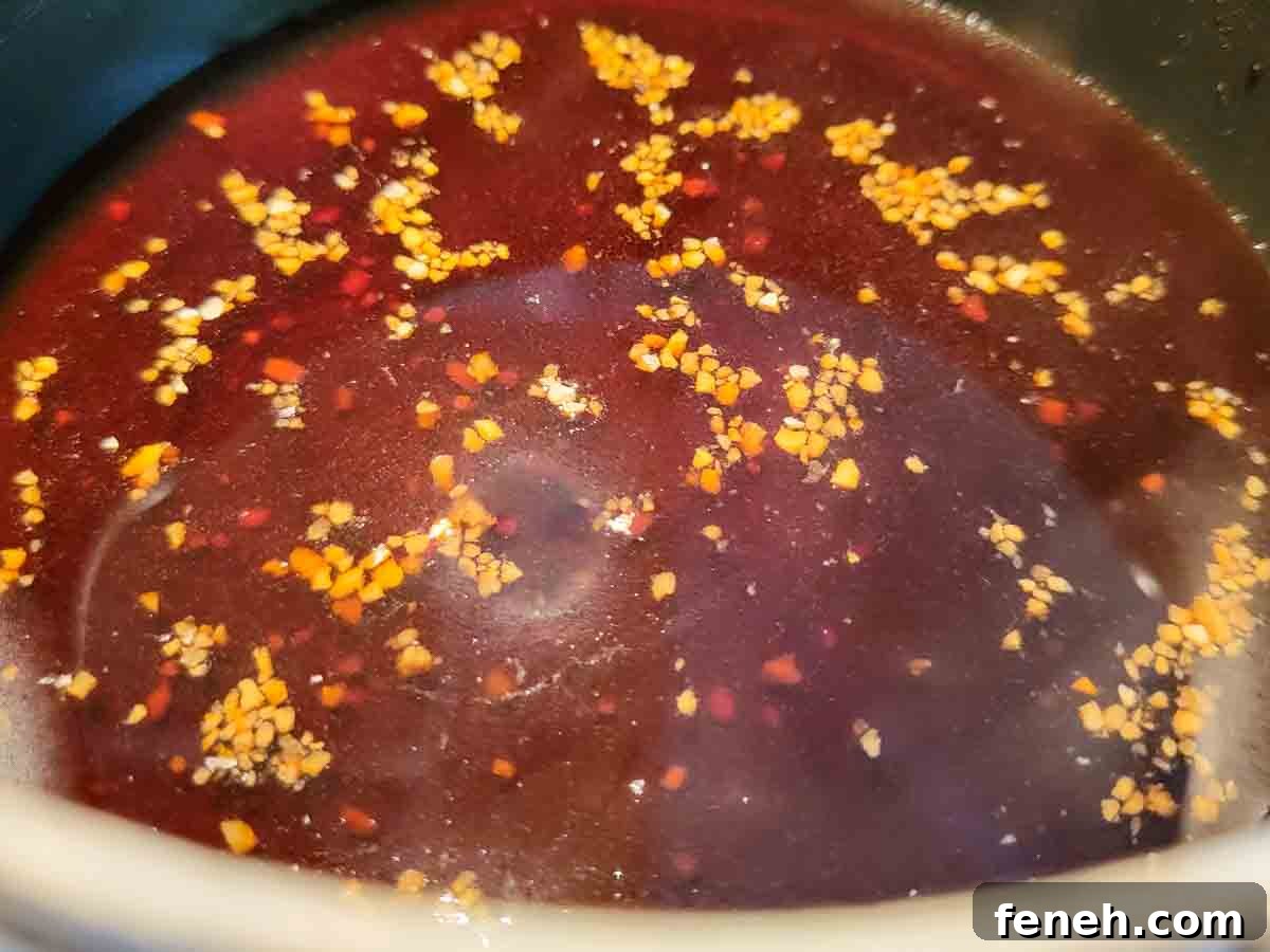 teriyaki sauce cooking in a pan.