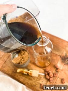 Brown Sugar Simple Syrup being poured into a glass