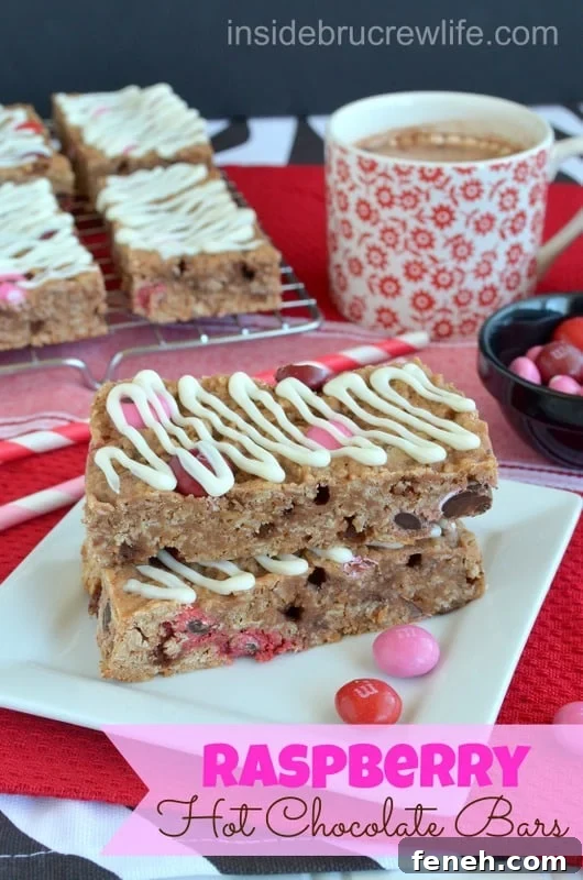 A stack of two Raspberry Hot Chocolate Granola Bars on a white plate