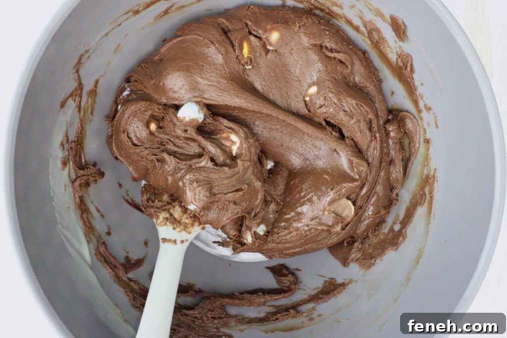 fold in mini eggs to chocolate mixture
