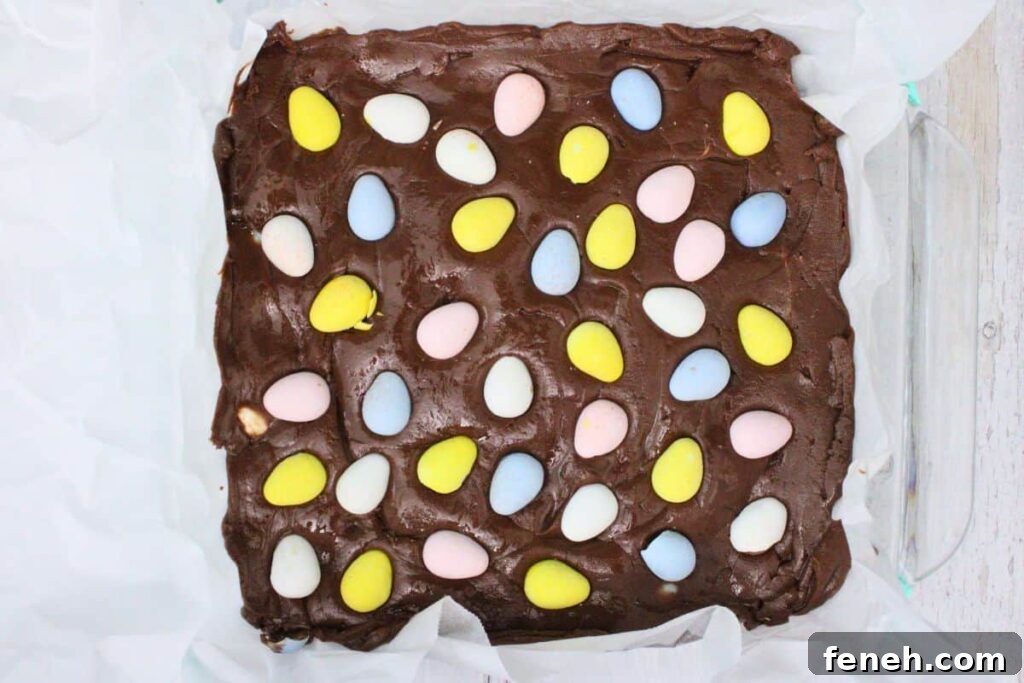 pour fudge mixture into prepared pan then add remaining eggs on top