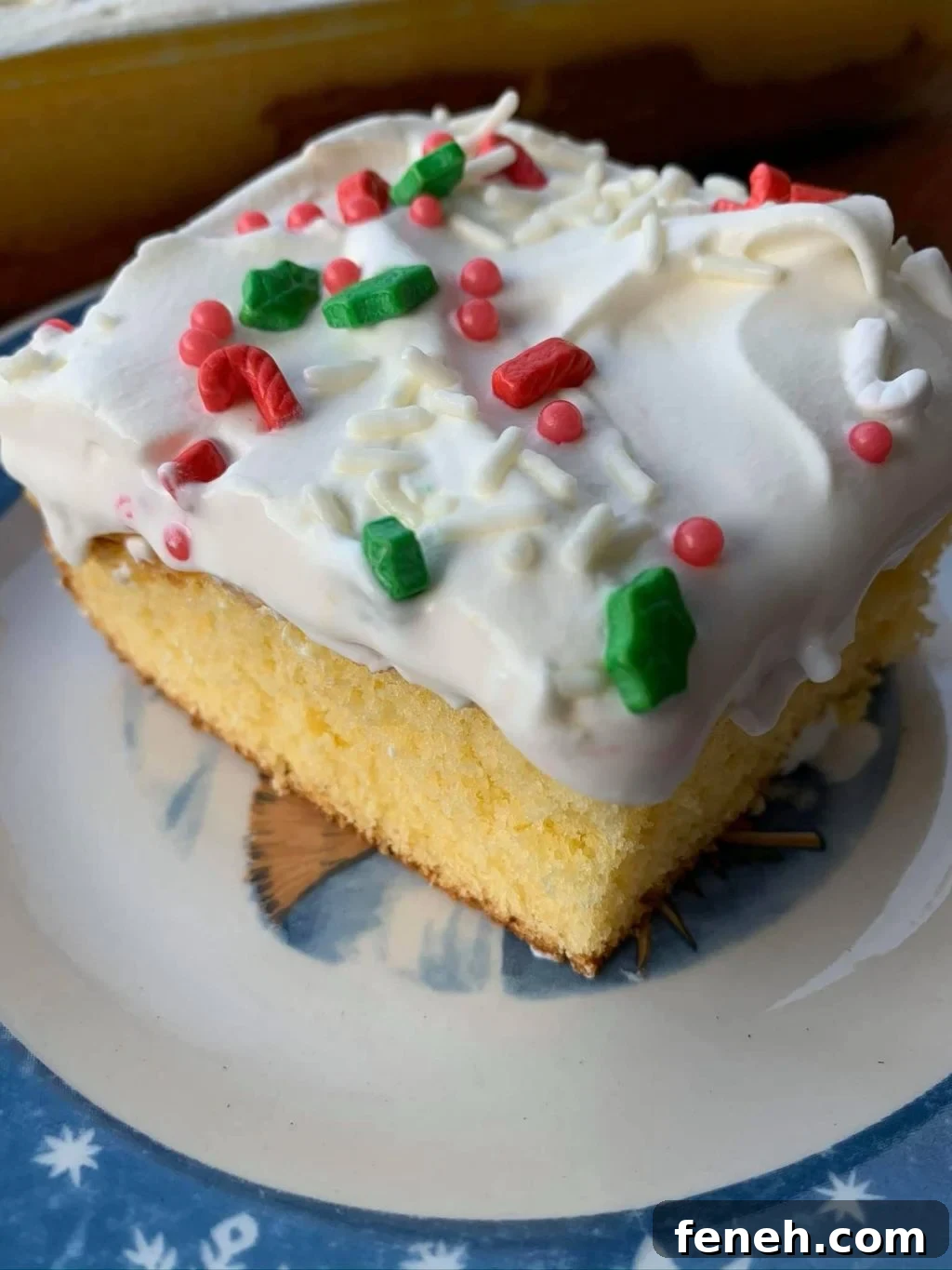 A close up of a piece of egg nog layer cake