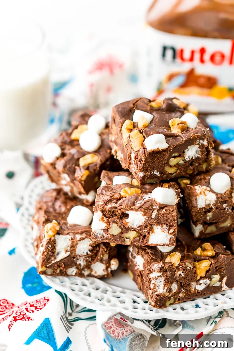 Nutella Rocky Road Fudge on white plate with tub of Nutella.