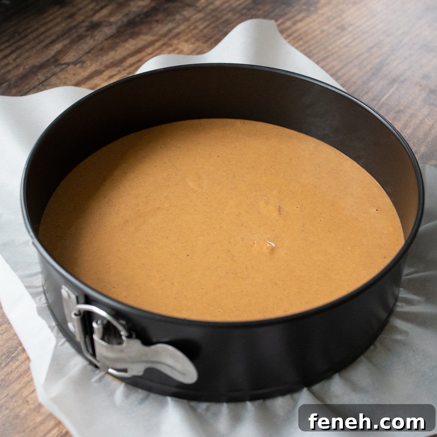 pumpkin pie filling unbaked in a springform pan.