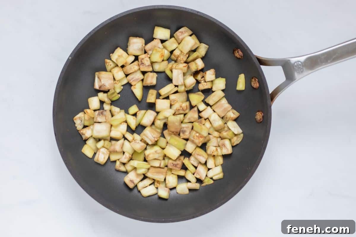 Cubed eggplant sauteed in small frying pan until just golden.