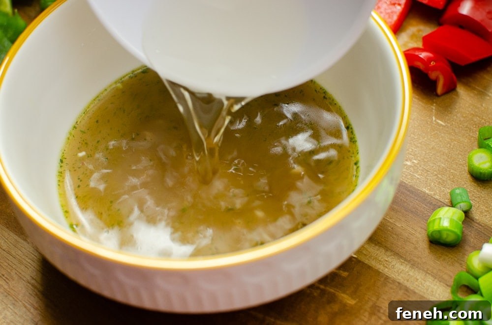 vegetable stock and white wine vinegar in a white bowl