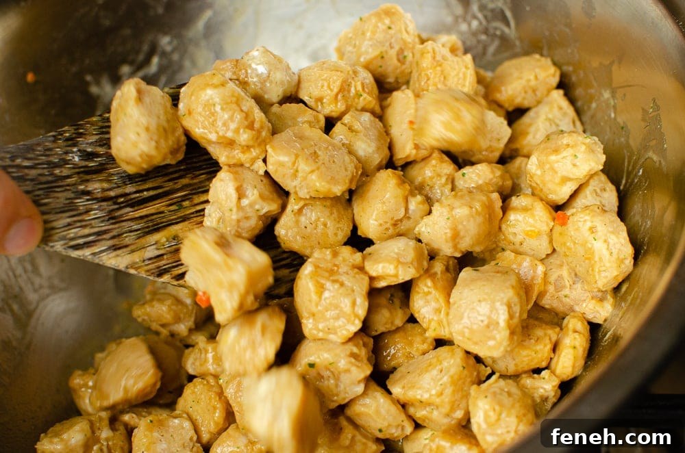 Stirring the Textured Vegetable Protein in a silver bowl