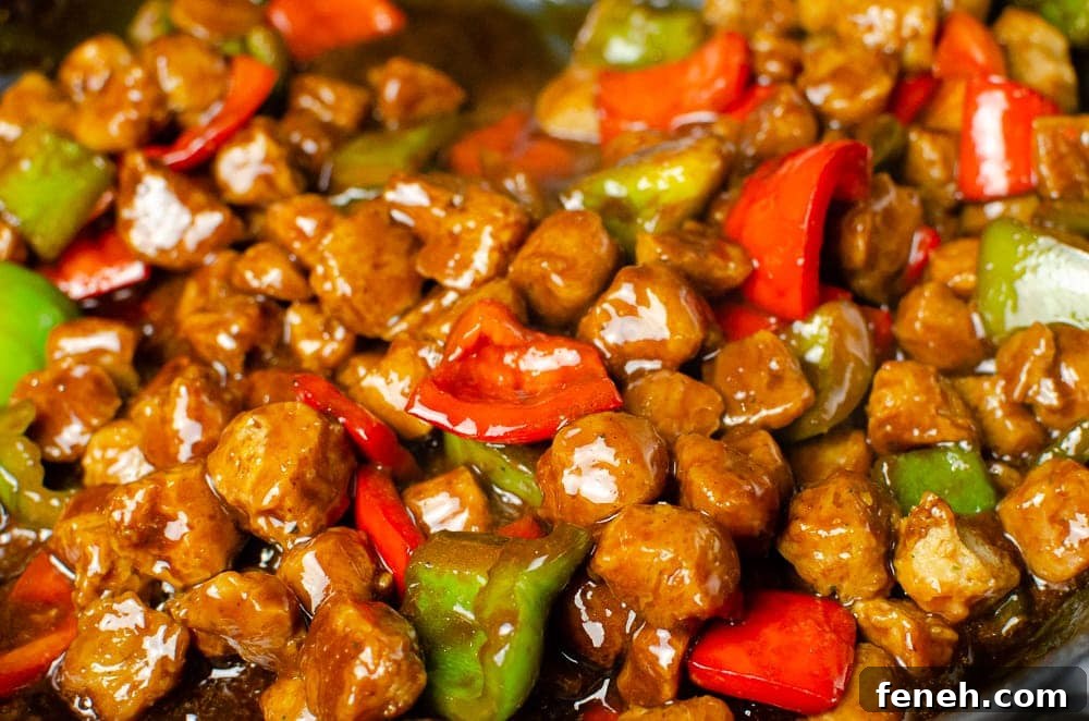 Textured Vegetable Protein mixed altogether with red and green peppers and kung pao sauce