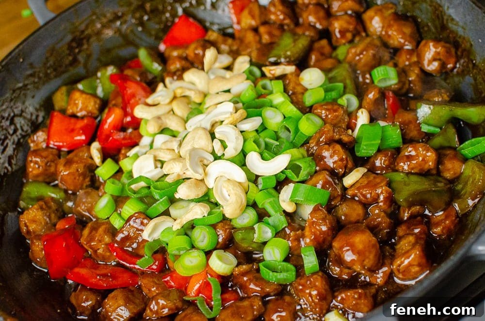 Chopped spring onion and cashews on top of the Vegan Kung Pao