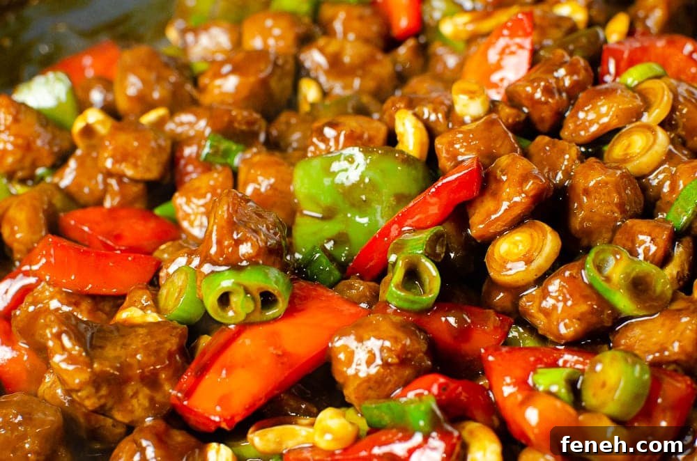 close up image of Vegan Kung Pao all mixed together with peppers and TVP