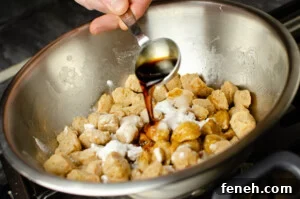 Soy Sauce being poured over the Textured Vegetable Protein