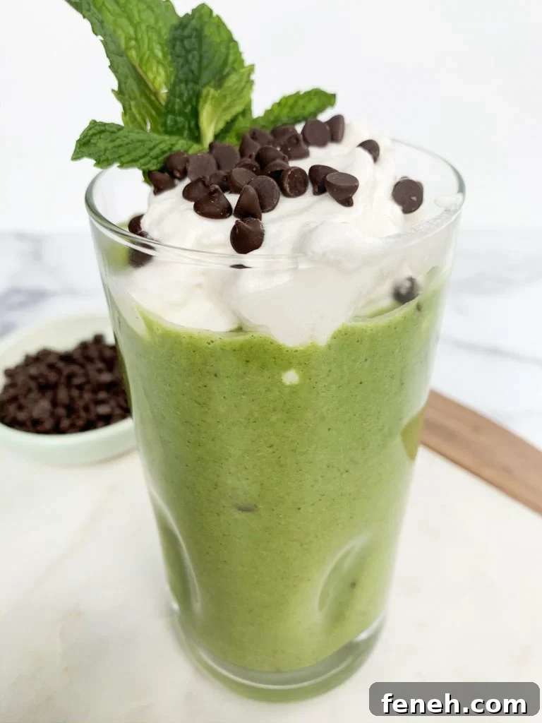 mint chip smoothie in a tall clear glass