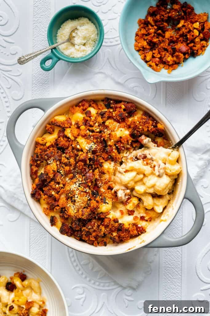 pot of air fryer mac and cheese topped with chorizo crumbs 