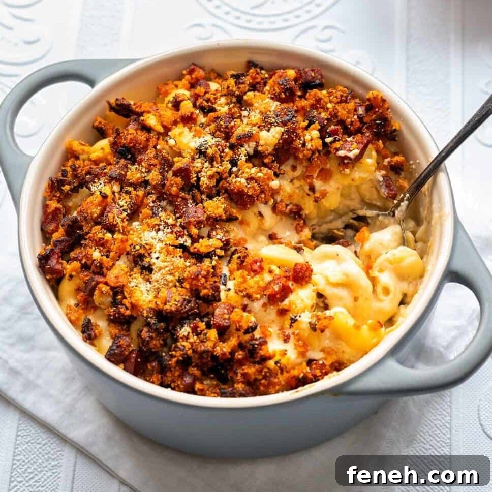 Mac and cheese with chorizo in a ceramic pot