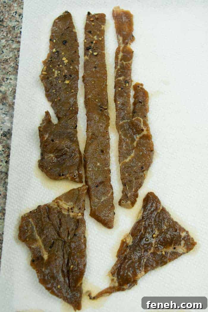 Zesty Lemon Pepper Beef Jerky: Tangy, Savory Snack Guide 12 Lemon pepper jerky drying on paper towels