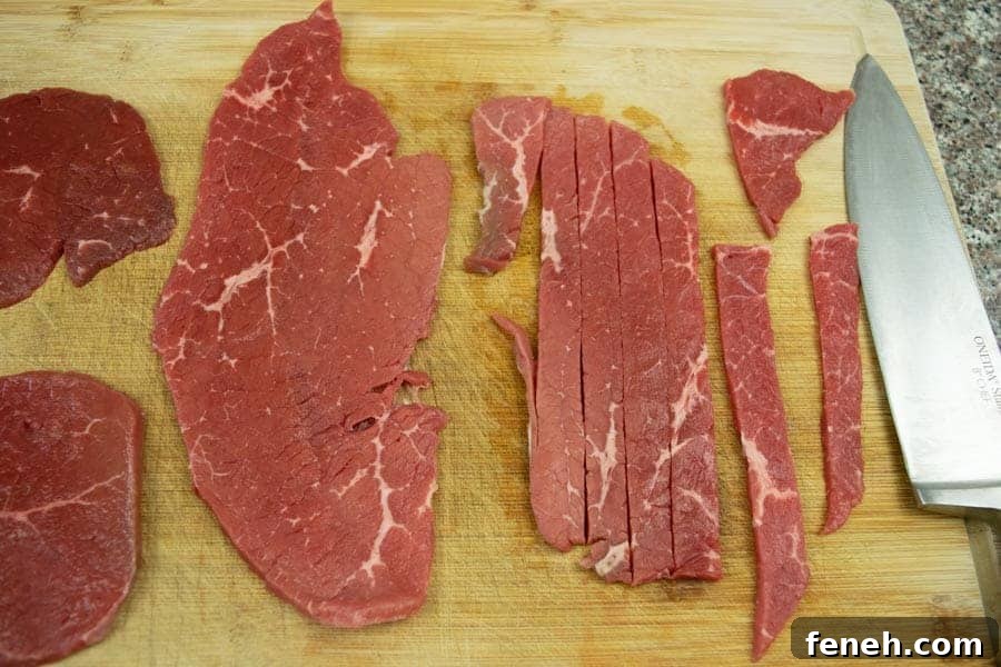 Zesty Lemon Pepper Beef Jerky: Tangy, Savory Snack Guide 5 Beef top round sliced thin on cutting board with knife