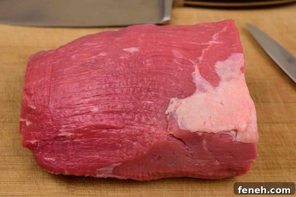 Zesty Lemon Pepper Beef Jerky: Tangy, Savory Snack Guide 6 Eye of Round Roast on cutting board