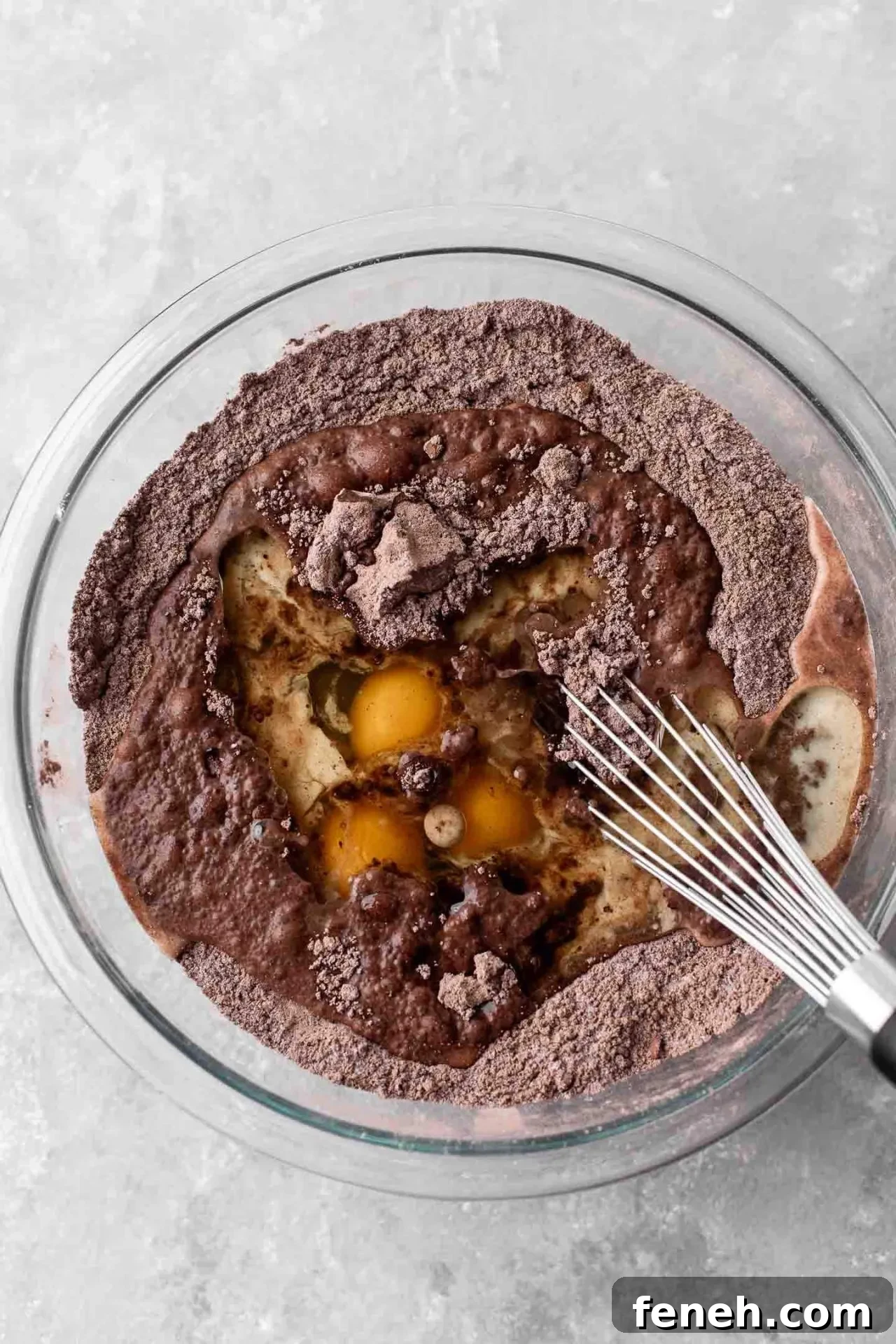 gluten free chocolate cake wet ingredients added to dry ingredients in bowl