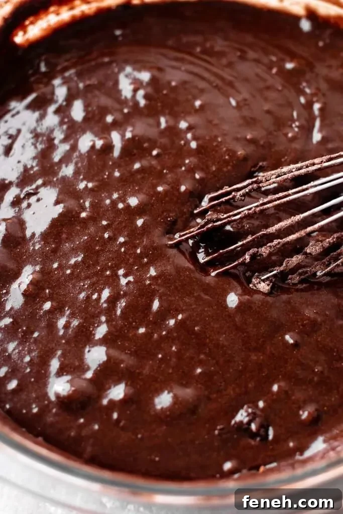 gluten free chocolate cake batter ingredients whisked together in bowl minus the hot coffee