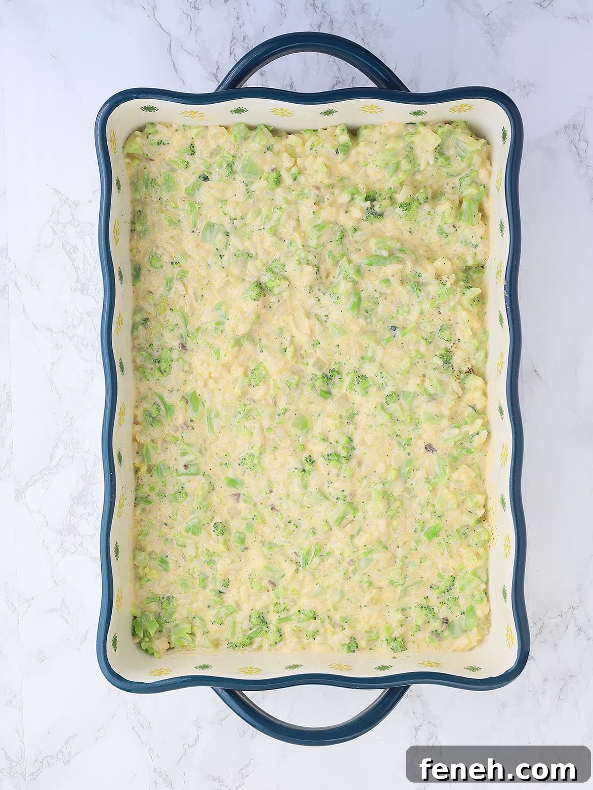 cheesy broccoli casserole spread into a 9 x 13 x 2 inch casserole dish