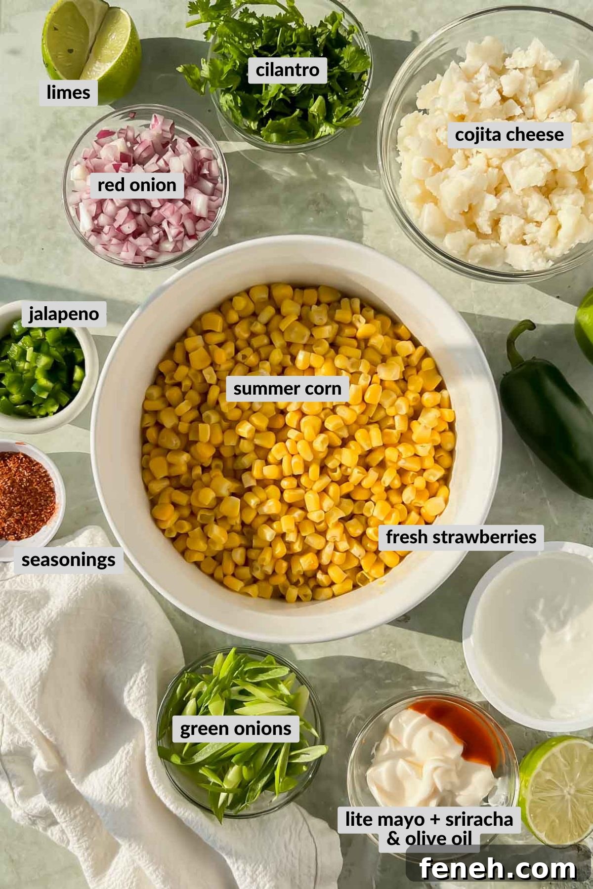 labeled ingredients for elote in a cup in individual bowls.