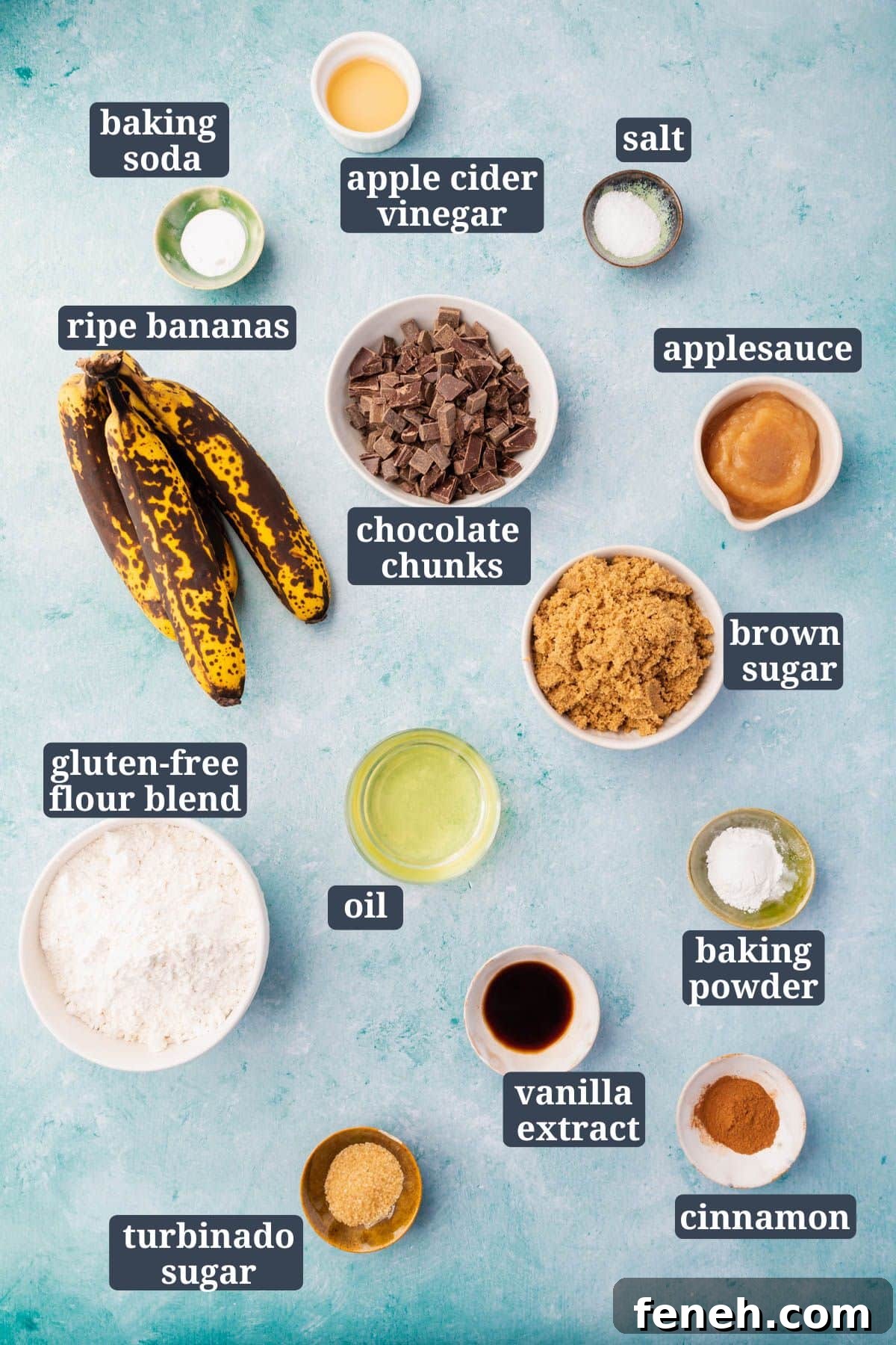 Ingredients in small bowls on a blue background to make gluten-free vegan chocolate chunk banana bread.