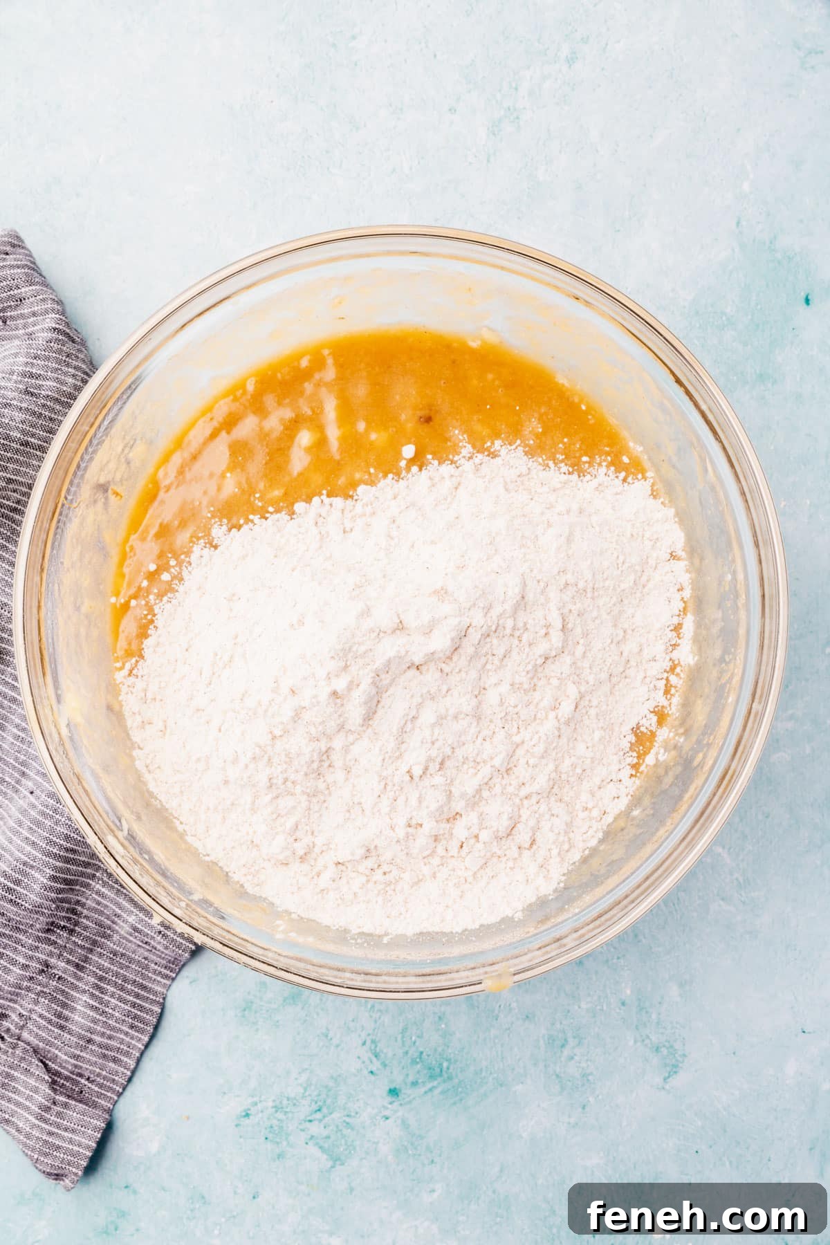 Wet mixture topped with gluten-free flour.