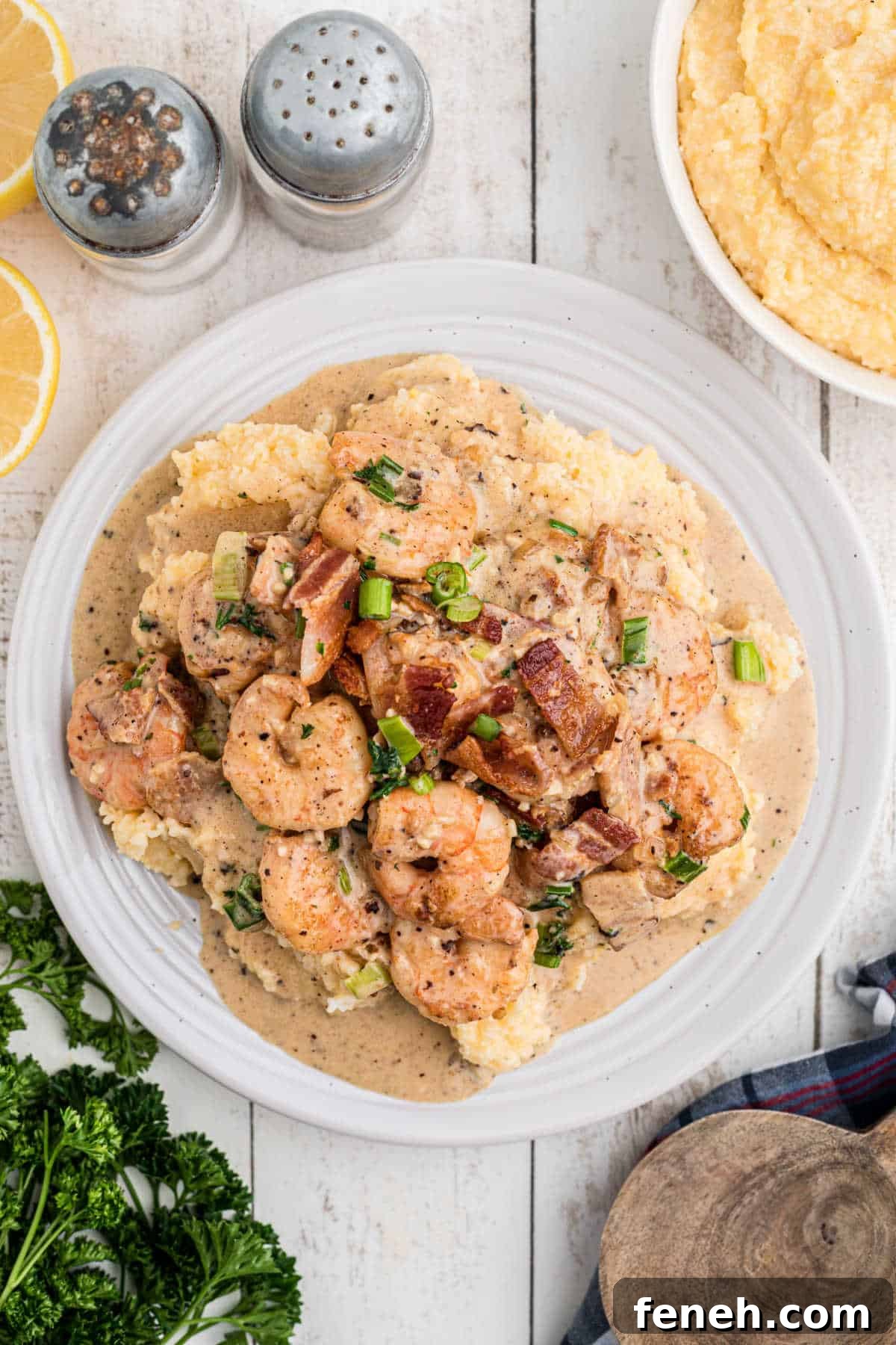 Overhead shot of a plate of Creole shrimp and grits.