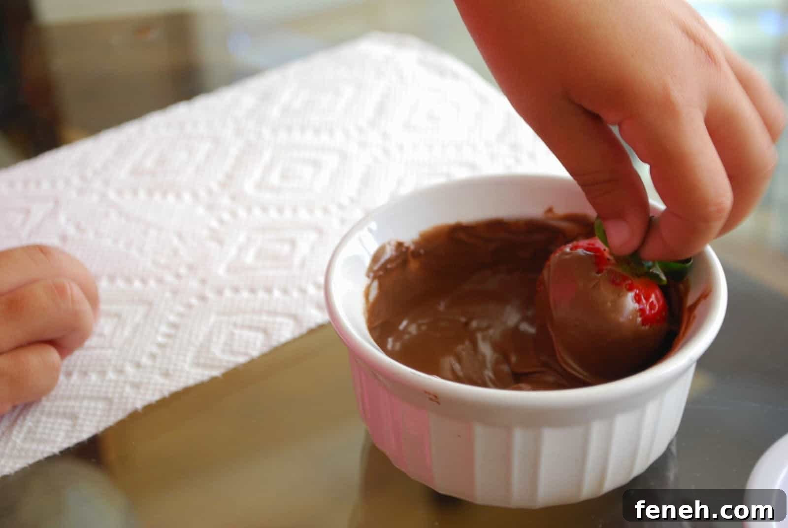 dipping strawberry in chocolate