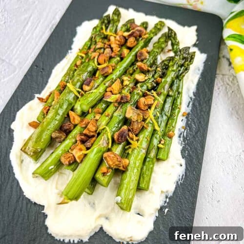 Oven Roasted Asparagus with Mascarpone on a black platter.