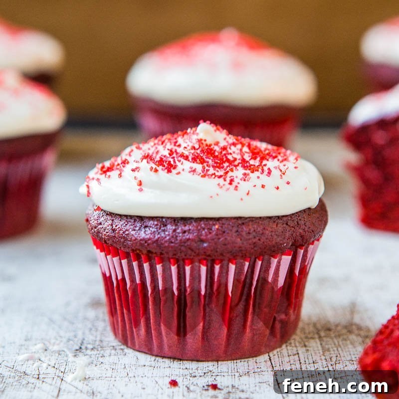 Red Velvet Cupcakes with Silky Vanilla Cream Cheese Frosting 6 Red velvet cupcakes with cream cheese frosting and red sprinkles.