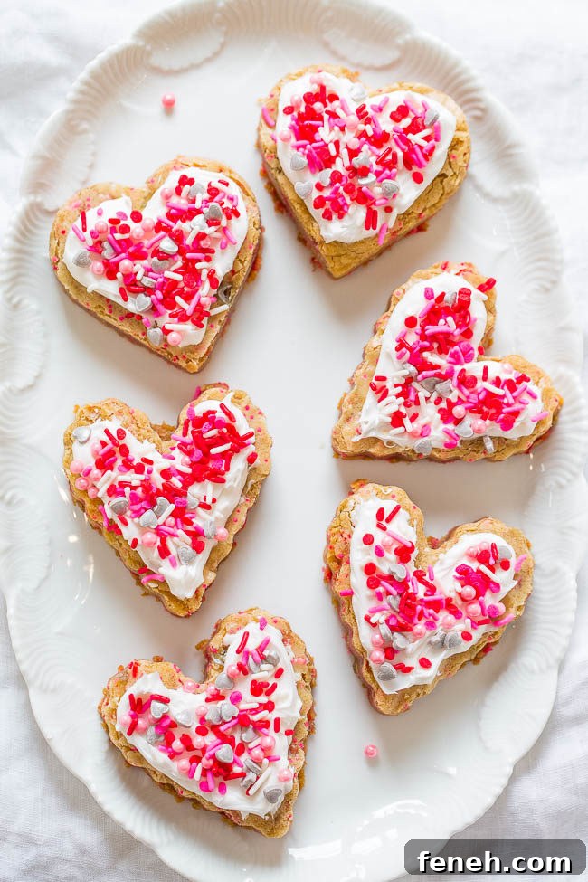 Red Velvet Cupcakes with Silky Vanilla Cream Cheese Frosting 10 Soft Frosted Valentine's Heart Cookies.