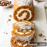 pumpkin swiss roll cake with candied pecans