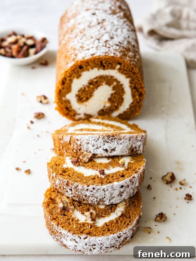 pumpkin swiss roll cake with candied pecans