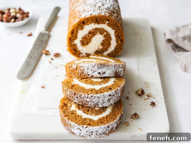 sliced pumpkin roll cake with knife
