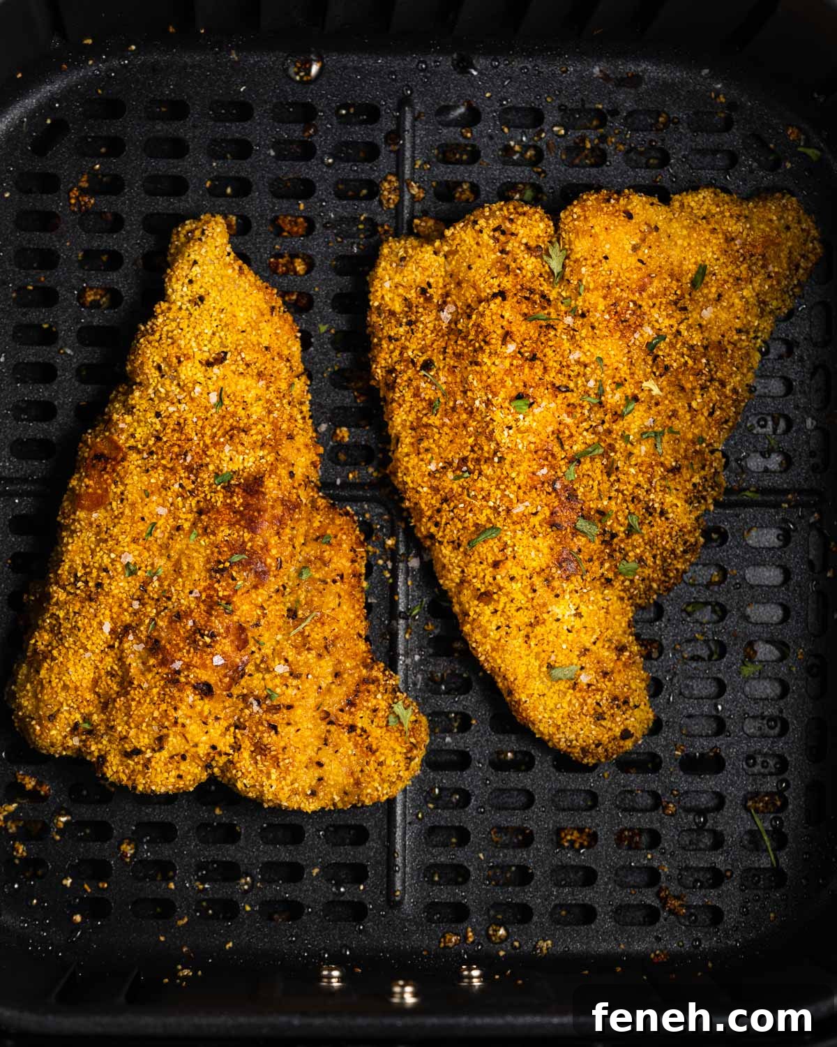 air fried catfish in air fryer basket.