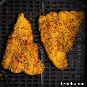 air fried catfish on an air fryer basket.