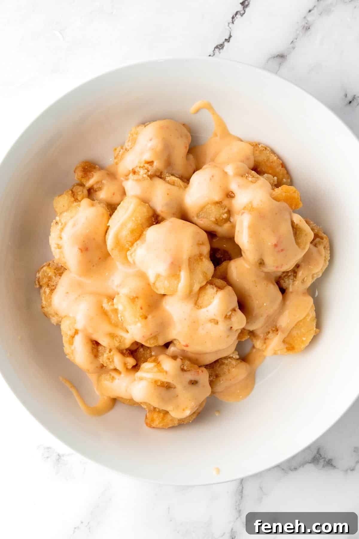 Bang Bang Sauce drizzled over fried shrimp