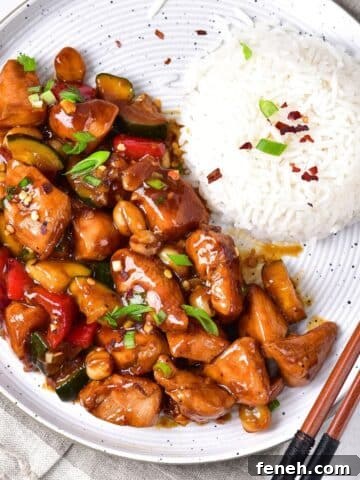 A plate of gluten-free kung pao chicken and rice.