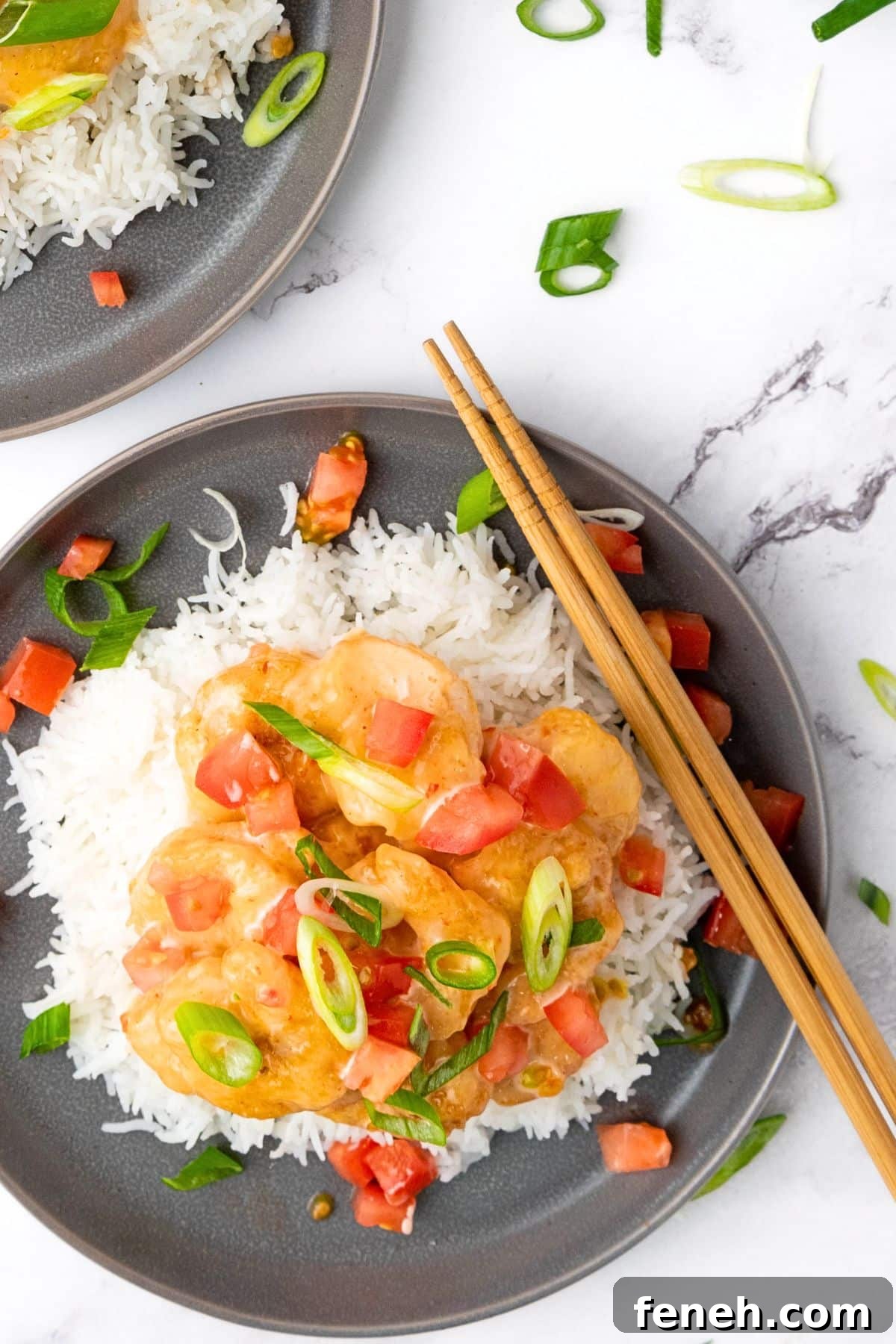 Top down view of healthy bang bang shrimp over rice.