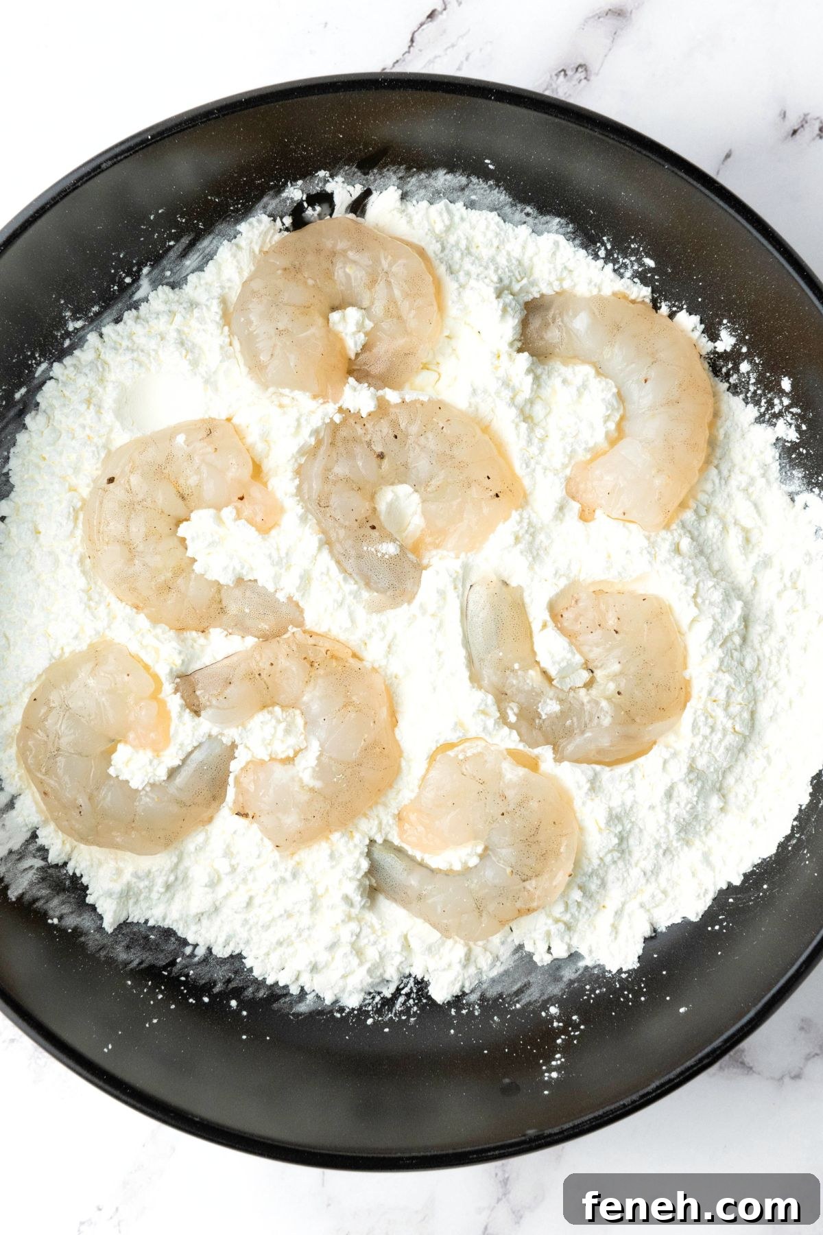 Coating shrimp in cornstarch