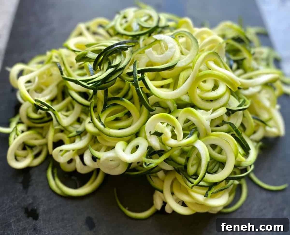 Zoodles on a cutting board. 