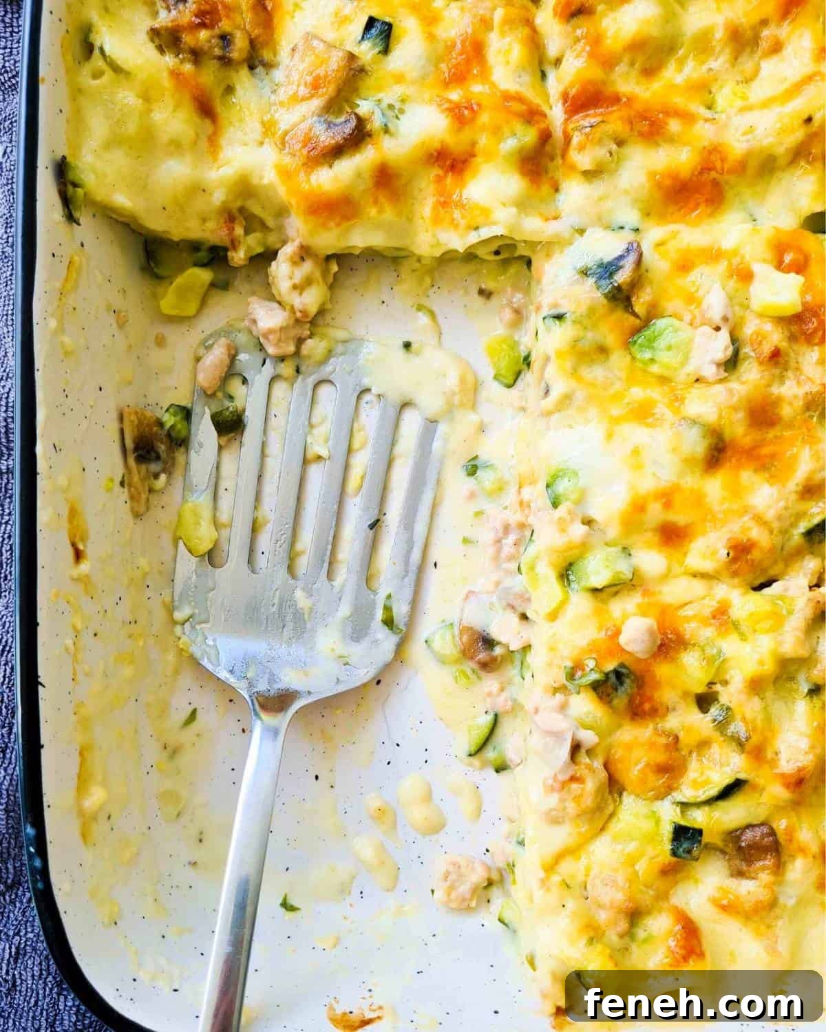 A fish spatula inside a baking dish 