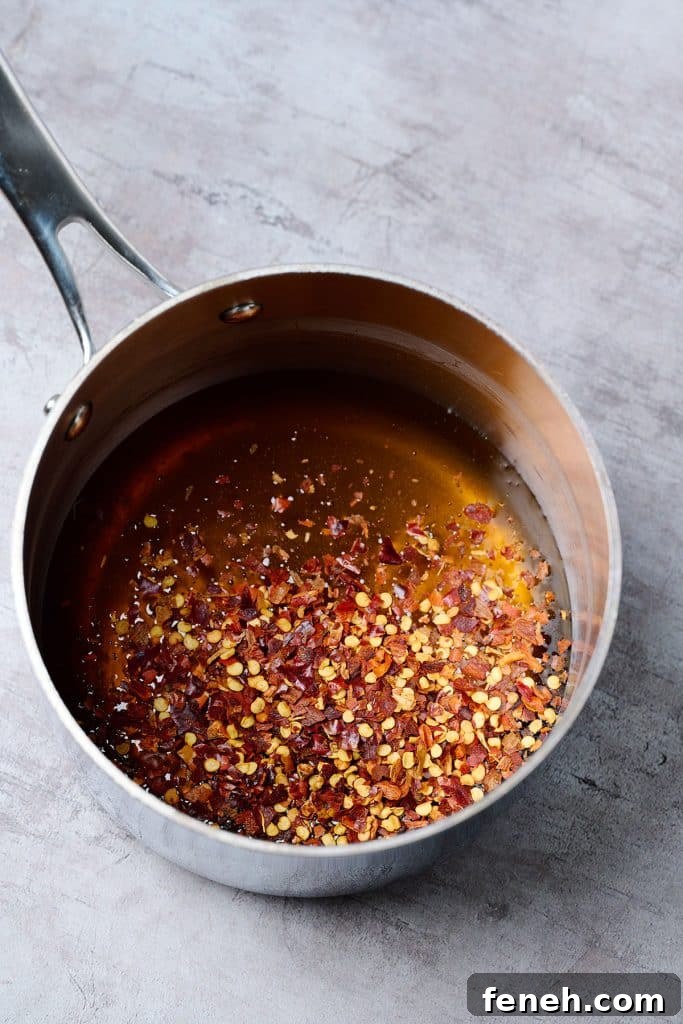 honey, chili flakes and chili powder in a small saucepan